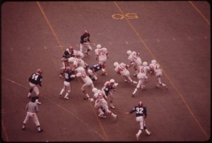 Image of a football game from the 70's 